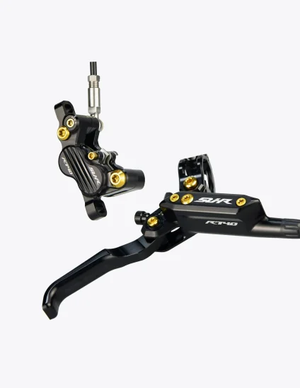 Frenos SUHR en color negro con tornillos de titanio en color dorado