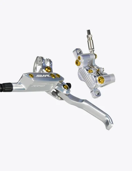 Maneta y pinza frenos SUHR en color plata y tornillos de titanio en color dorado